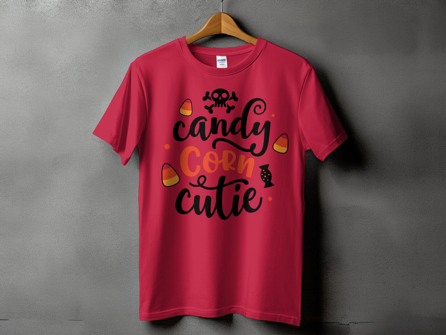 Red t-shirt with black text "Candy Corn Cutie" and Halloween graphics.