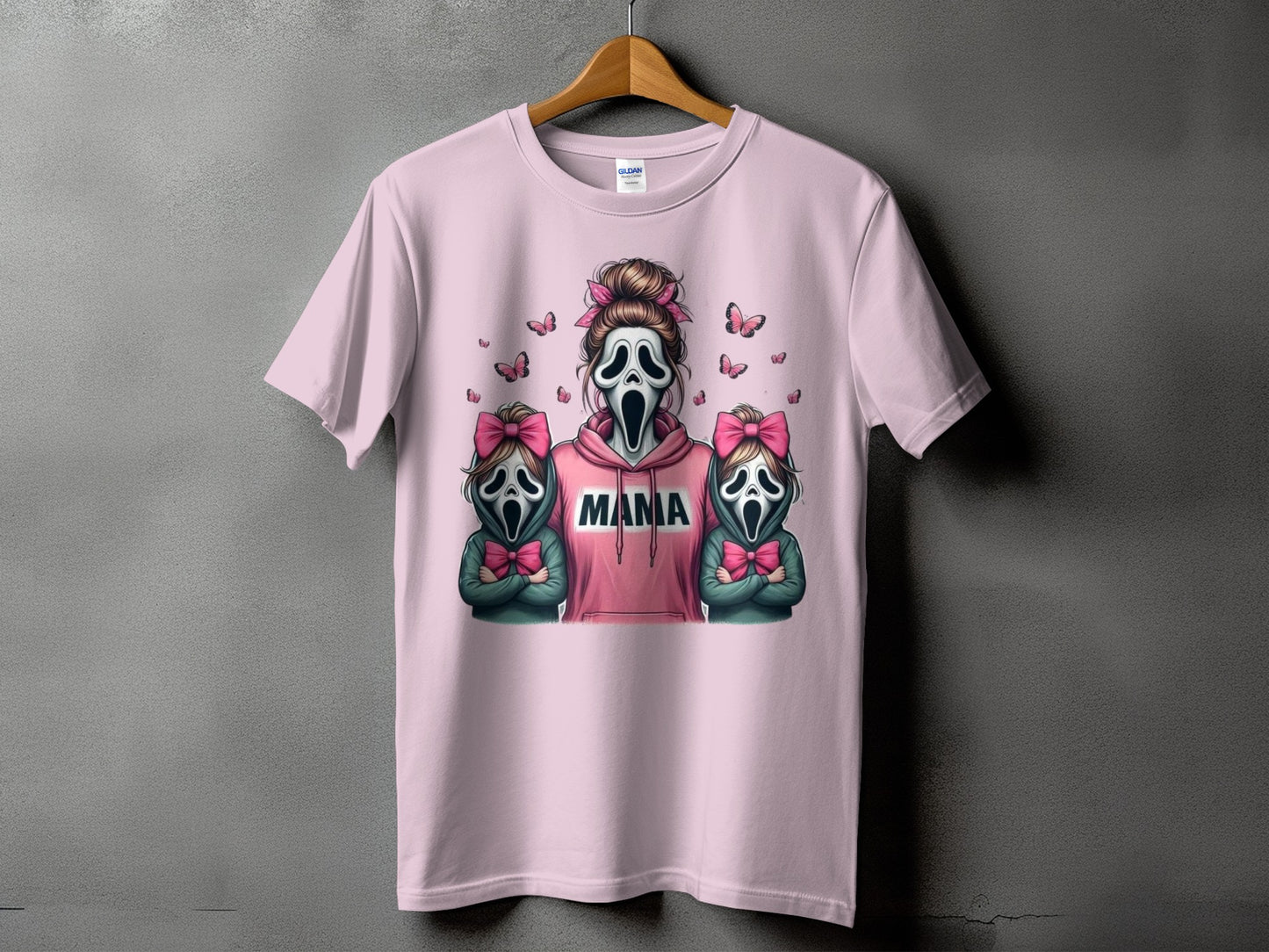 Pink t-shirt with a graphic of three Ghostface masks, text reads "MAMA."