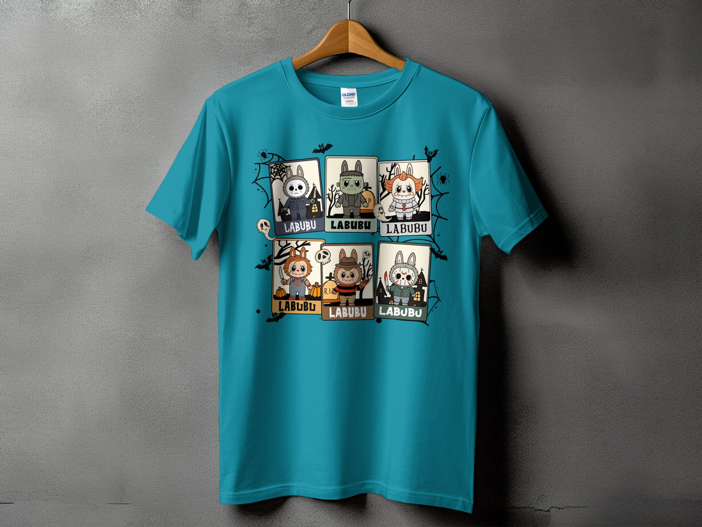 Teal t-shirt with six cartoon Halloween-themed characters, each labeled "LABUBU".