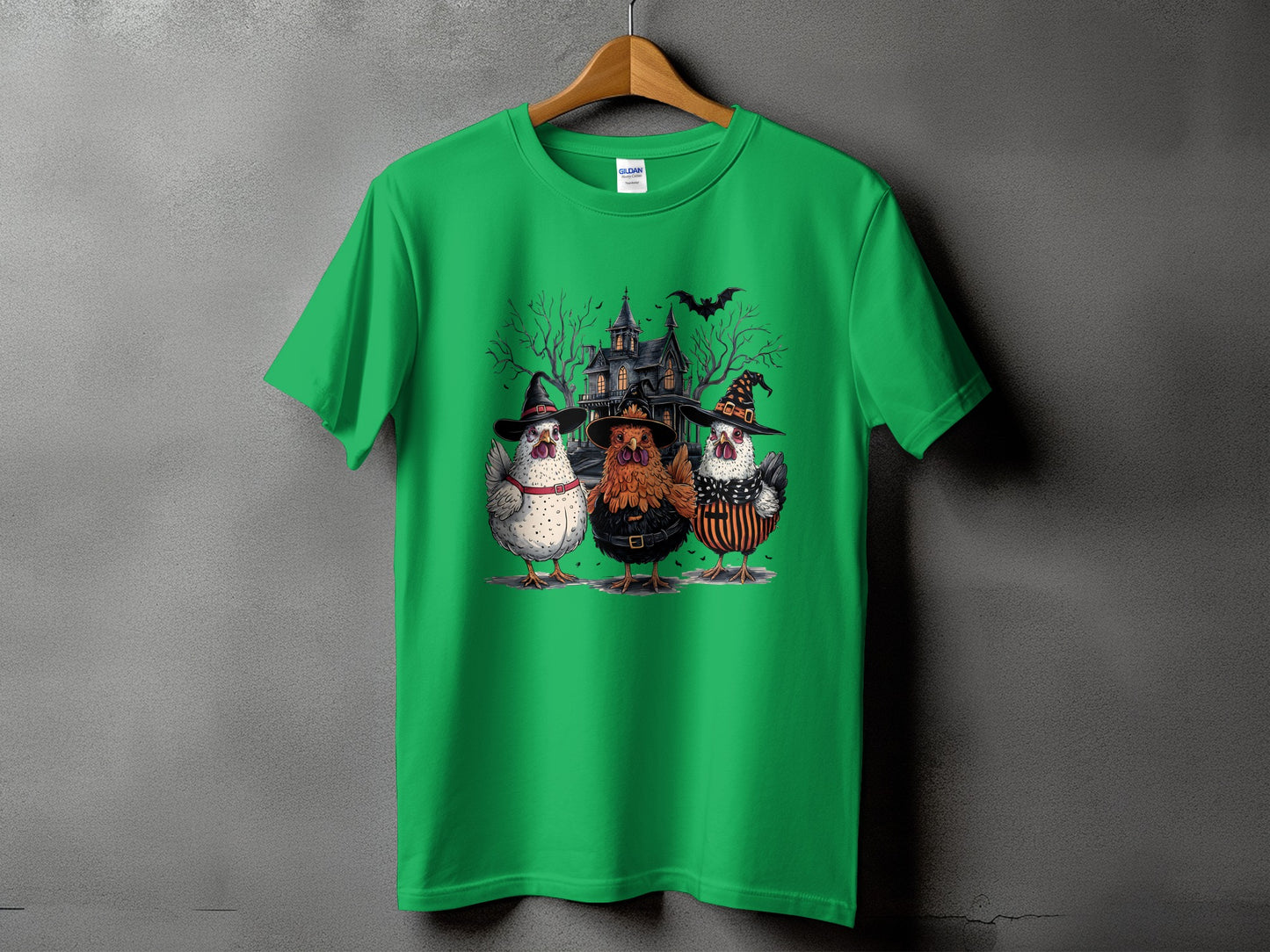 Green t-shirt with Halloween chickens and haunted house graphic.