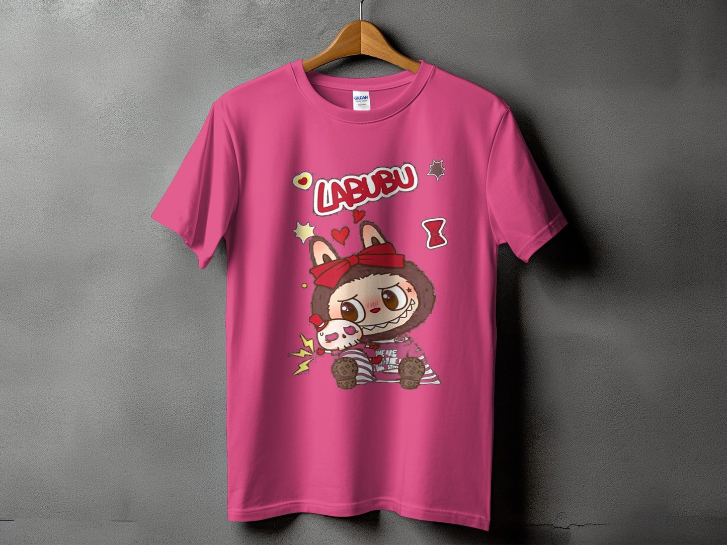 Pink t-shirt with "LABUBU" text and a cartoon character holding a skull.