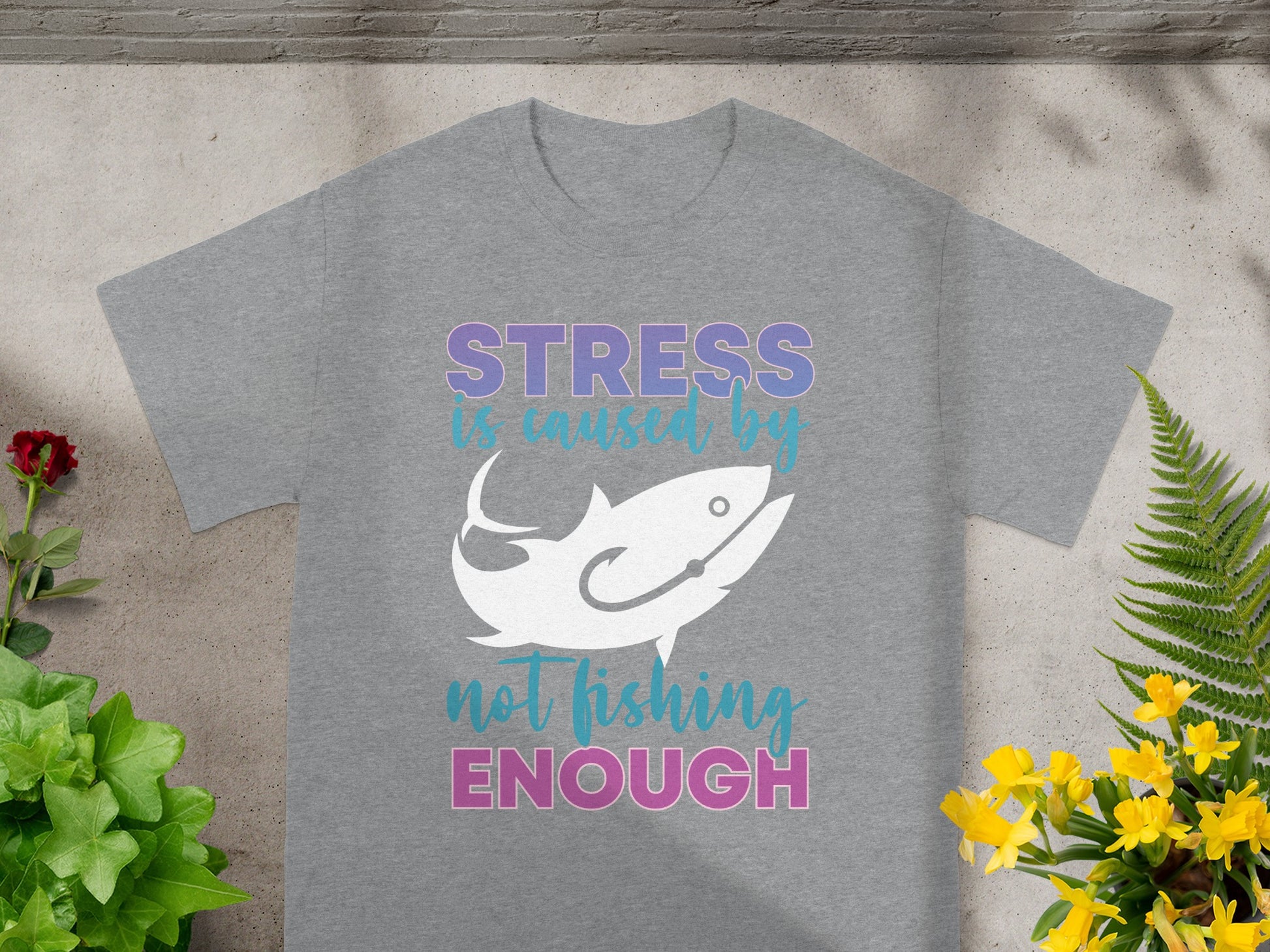 Gray t-shirt with "STRESS is caused by not fishing ENOUGH" and a fish graphic.