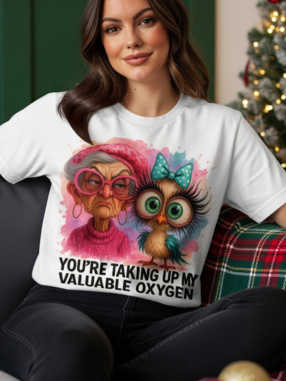 T-shirt with watercolor art of an owl and an elderly woman.