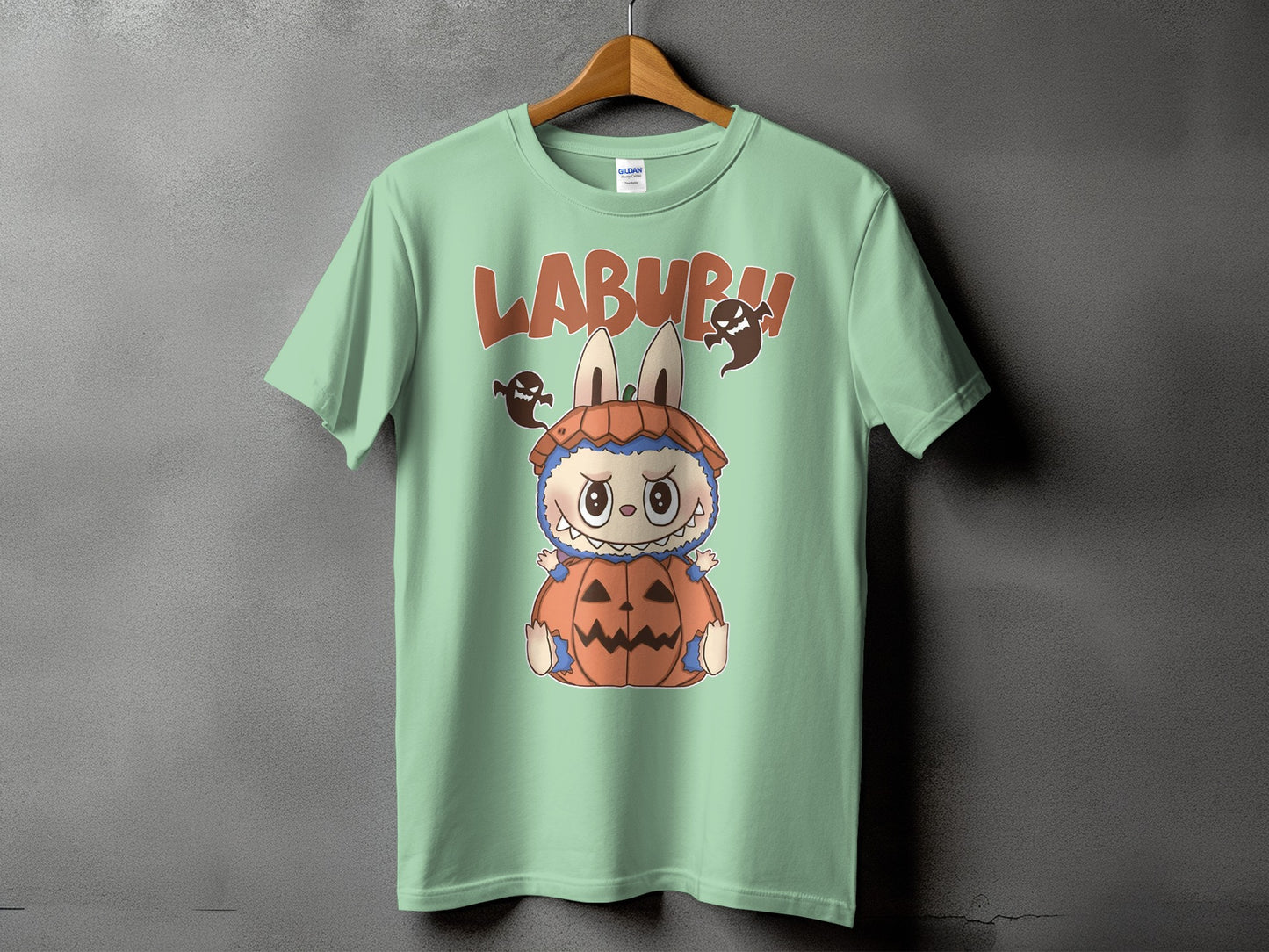 Light green t-shirt with "LABURH" text and cartoon monster in pumpkin costume.
