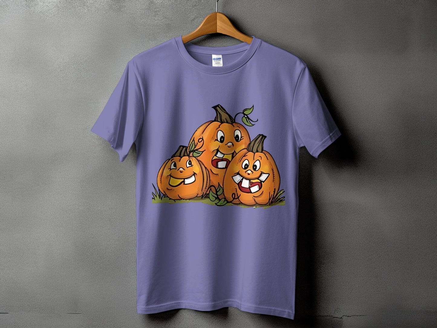 Purple t-shirt with three cartoon pumpkins with happy faces.