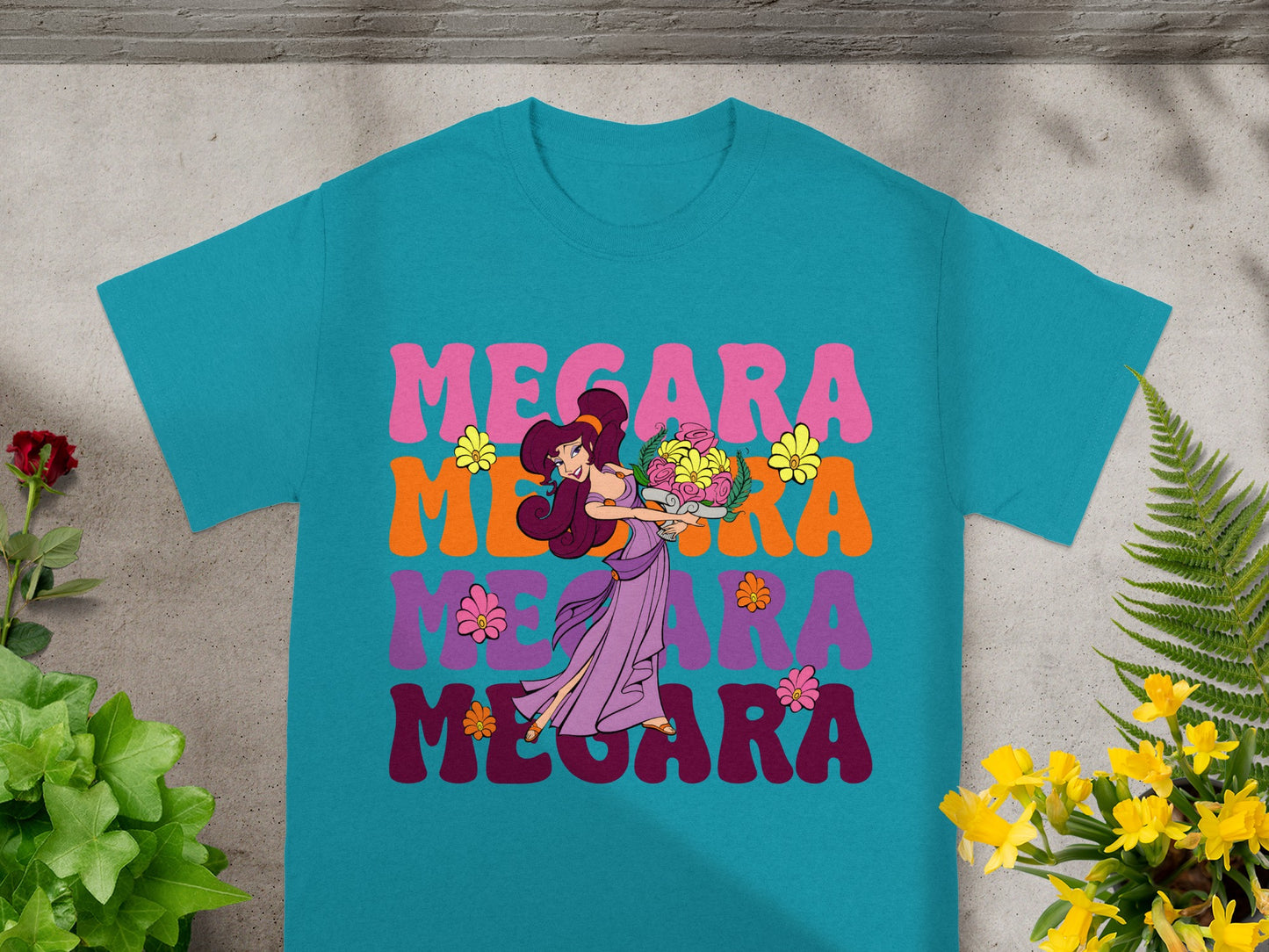 Teal t-shirt with Megara illustration and colorful text.