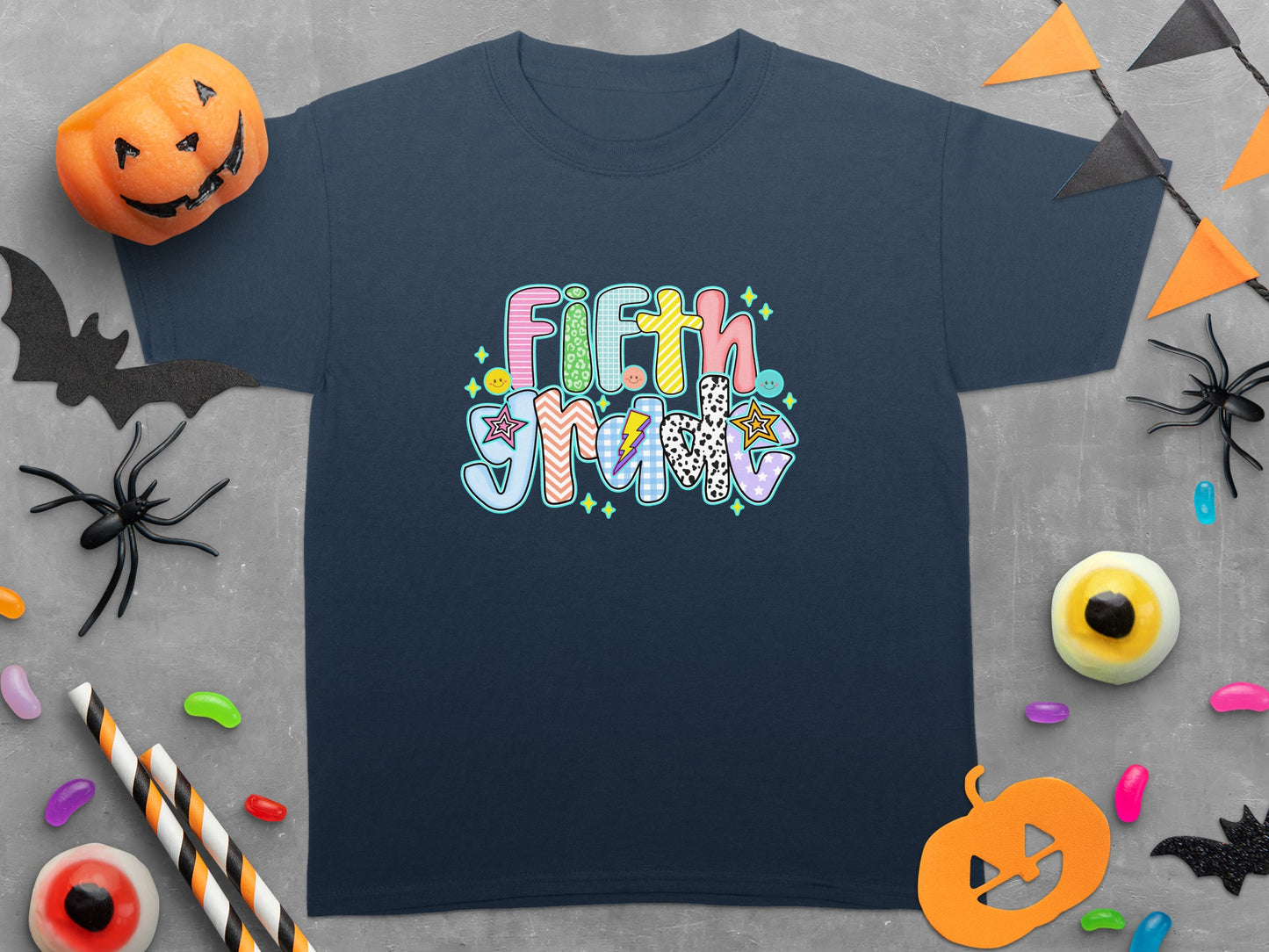 Navy t-shirt with "Fifth Grade" in colorful, patterned block letters.