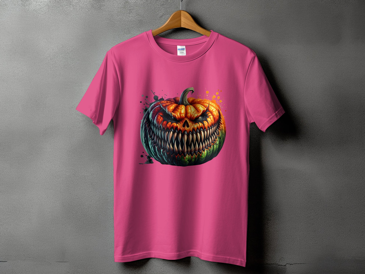 Pink t-shirt with a detailed, menacing jack-o'-lantern graphic and watercolor splatters.