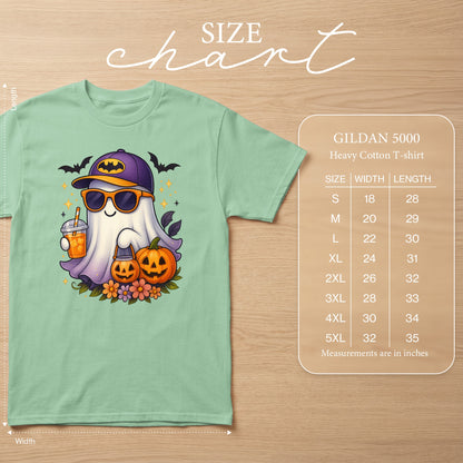 Mint green t-shirt with a cartoon ghost wearing a Batman hat and sunglasses, holding a drink and a pumpkin bucket.