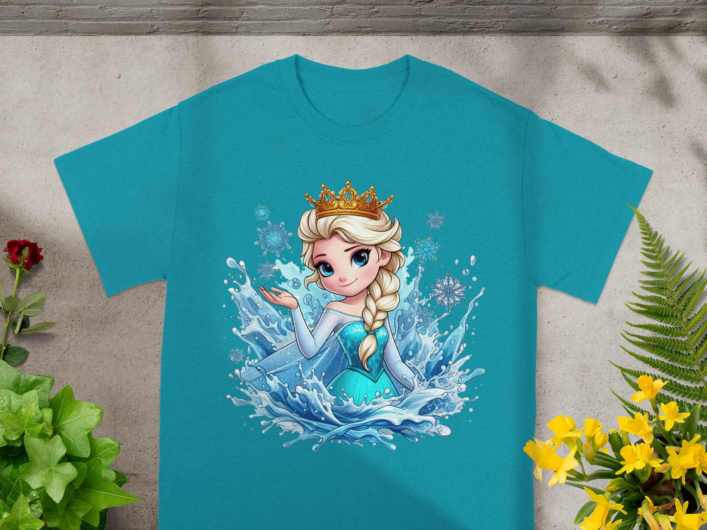 Teal t-shirt with Elsa from Frozen surrounded by water and snowflakes.