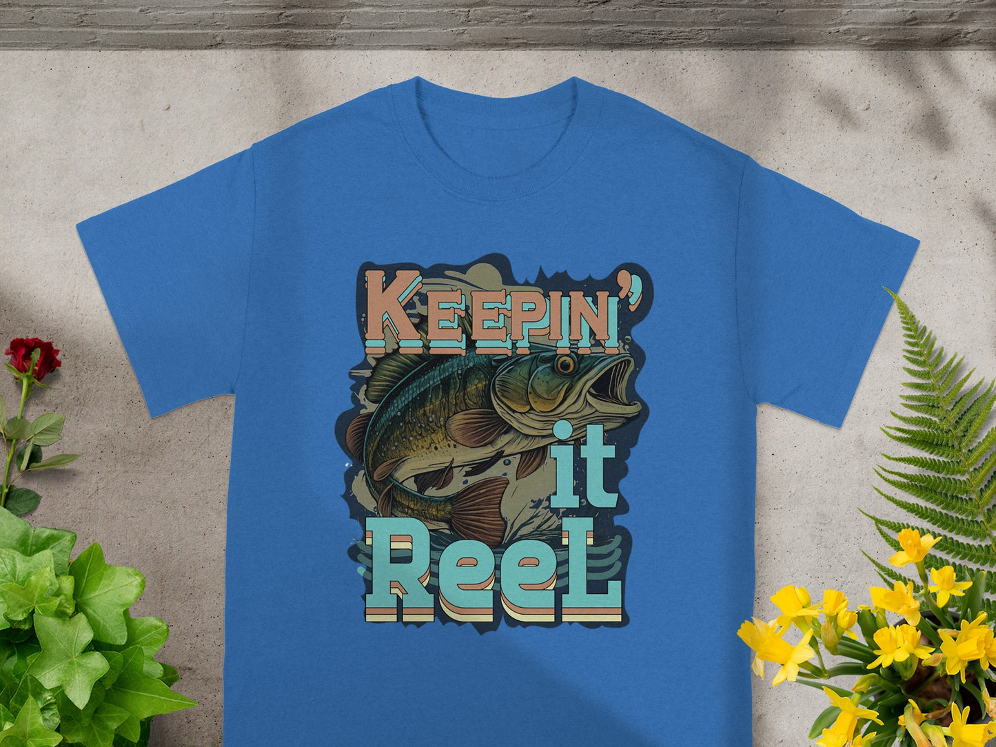 Blue t-shirt with "KEEPING it Reel" text and jumping bass graphic.