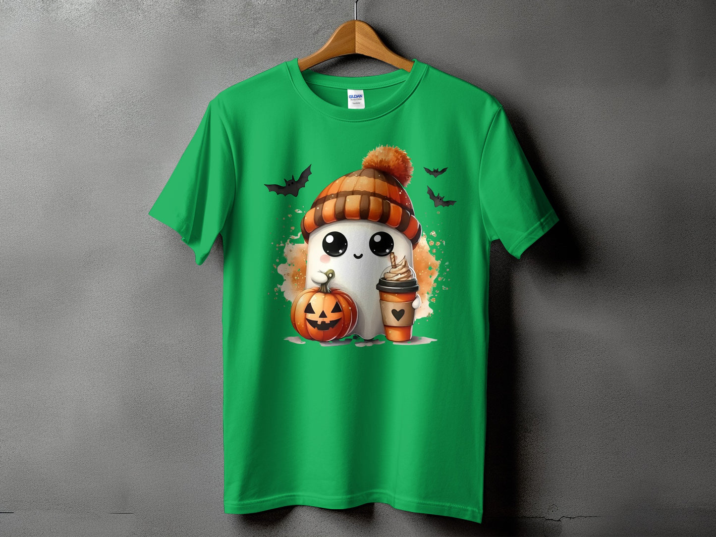 Green t-shirt with ghost, pumpkin, coffee, and bats Halloween graphic.