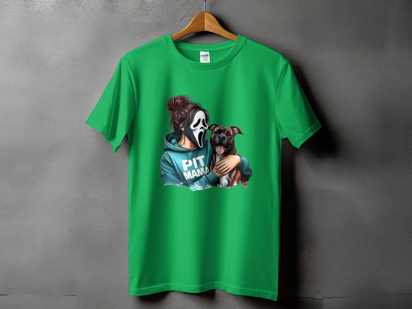 Green t-shirt with graphic of woman in scream mask holding pit bull, text PIT MAMA.