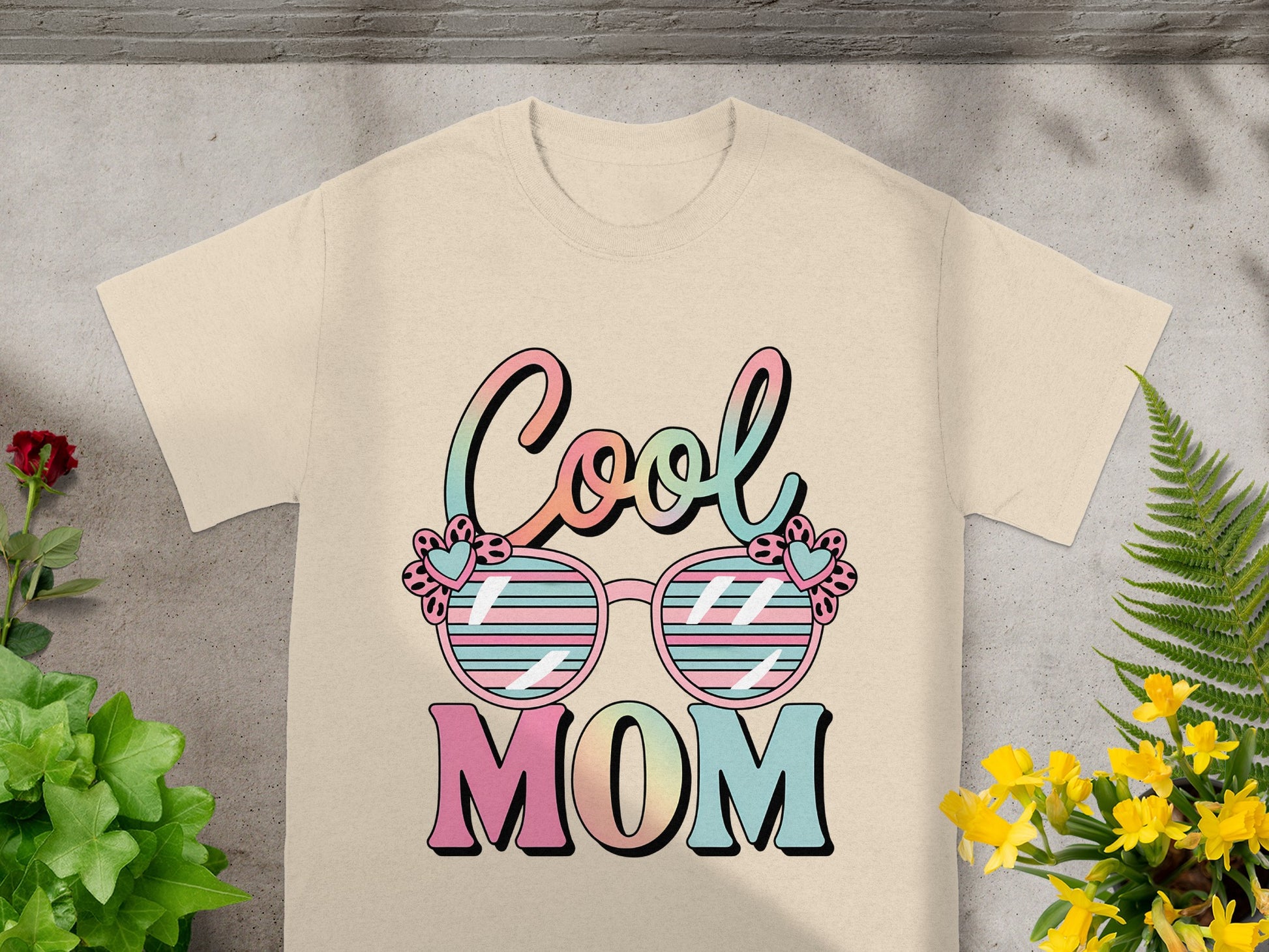 Cream t-shirt with "Cool Mom" text and sunglasses graphic.