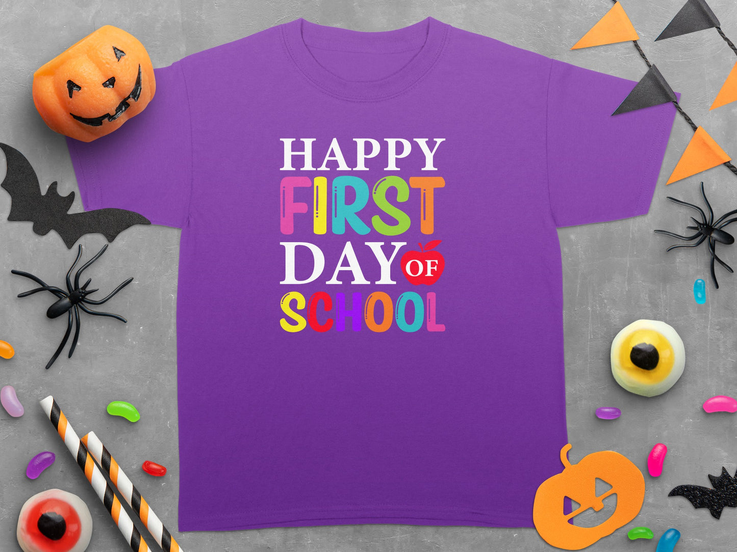 Purple t-shirt with "Happy First Day of School" in colorful block letters.