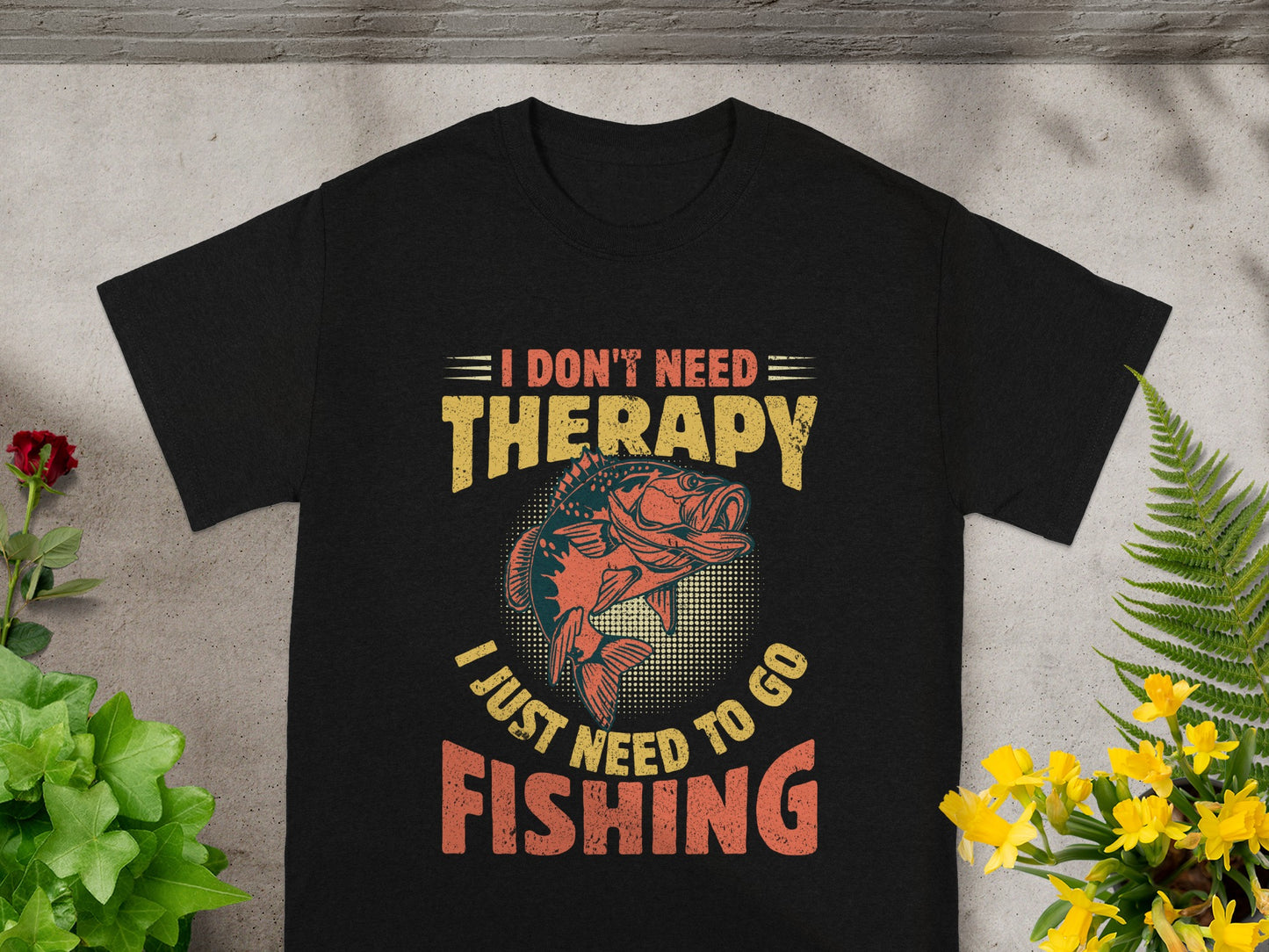 Black t-shirt with fishing graphic and text: I Don't Need Therapy, I Just Need To Go Fishing.