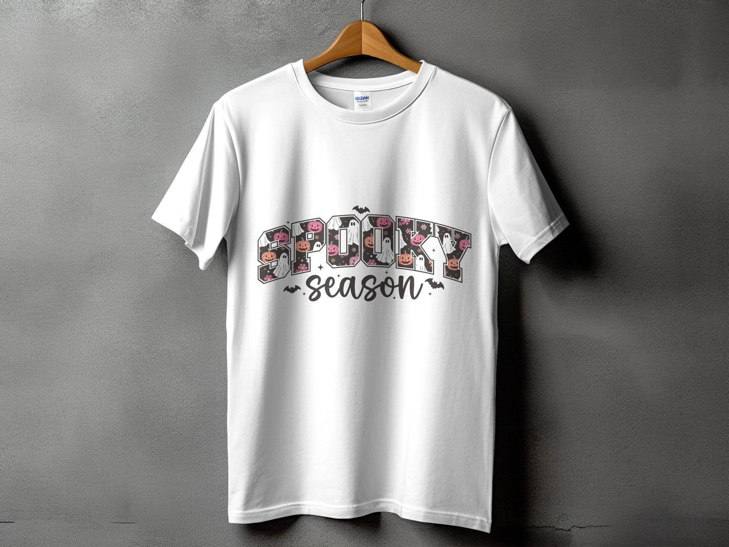 White t-shirt with "SPOOKY SEASON" text featuring Halloween imagery.