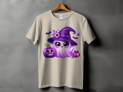 Ghost with witch hat and Halloween decorations on a tan t-shirt.