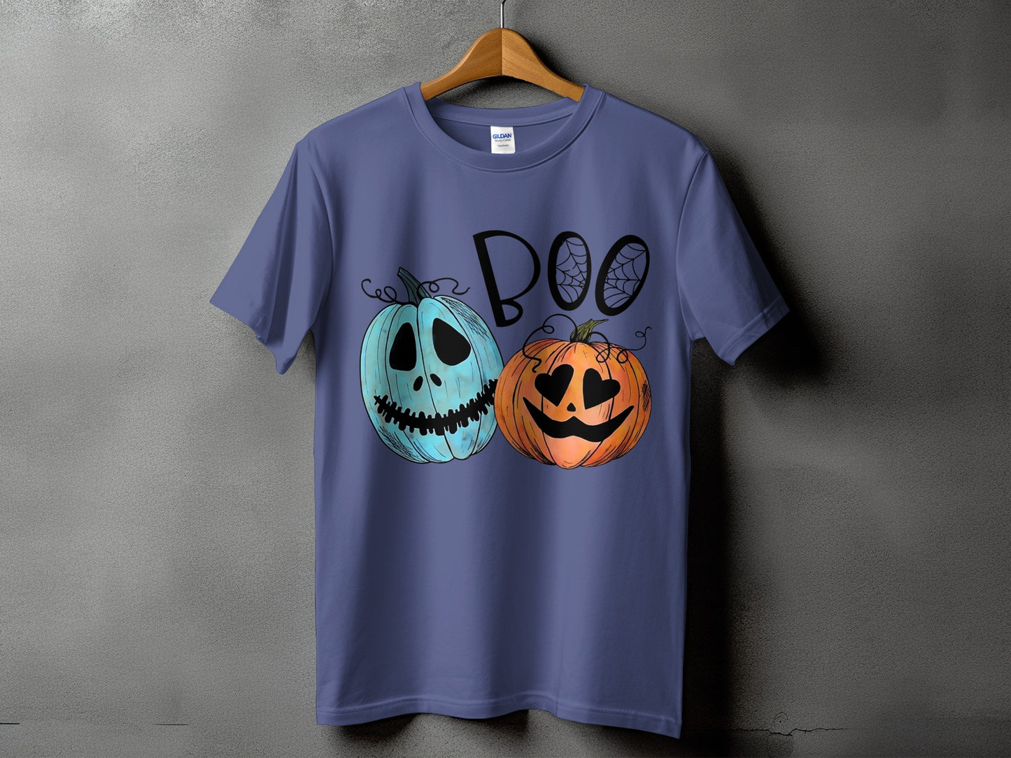 Purple t-shirt with blue and orange pumpkins and the word "BOO"