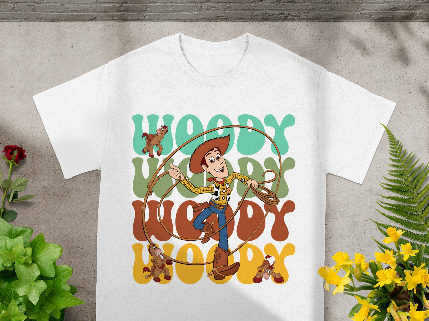 White t-shirt with Woody from Toy Story and "Woody" text.