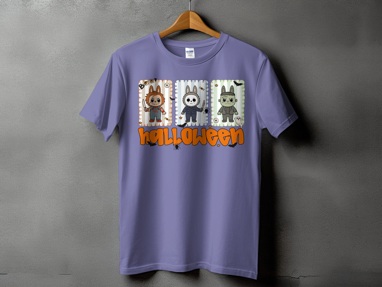 Purple t-shirt with three cartoon Halloween characters and the word "Halloween."