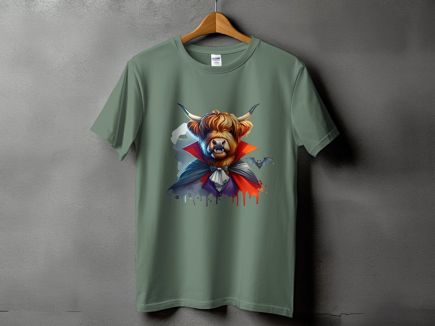 Highland cow dressed as Dracula with bats on a green t-shirt.