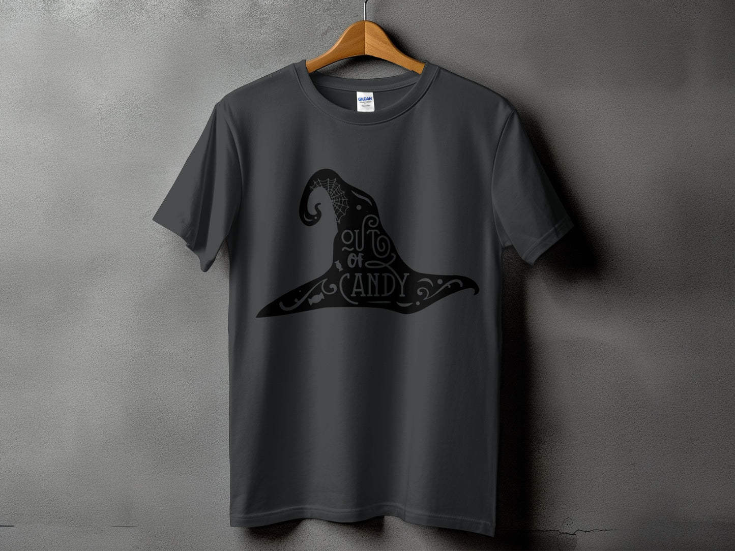 Dark gray t-shirt with black witch hat graphic that reads "out of candy."