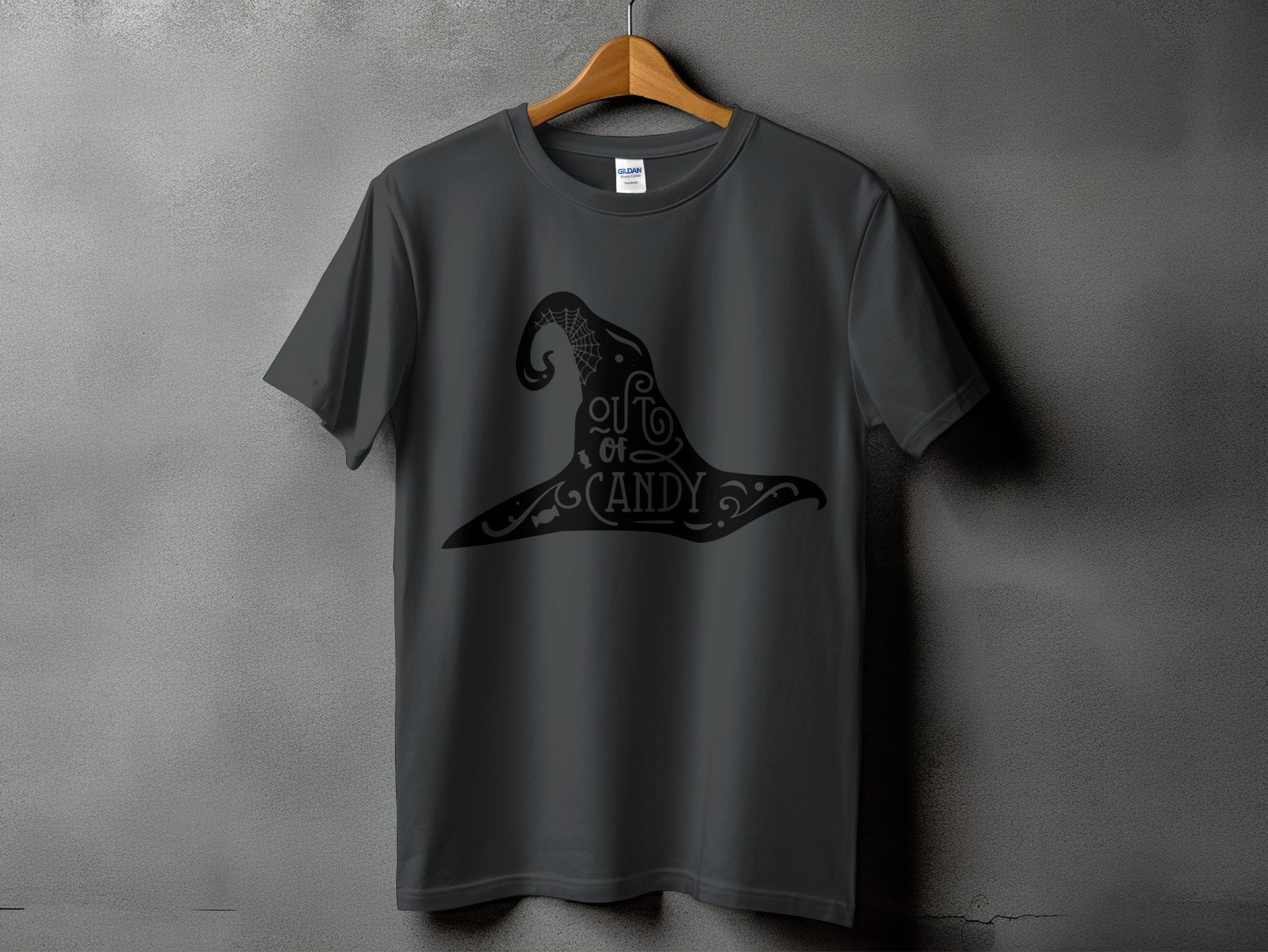 Dark gray t-shirt with black witch hat graphic that reads "out of candy."