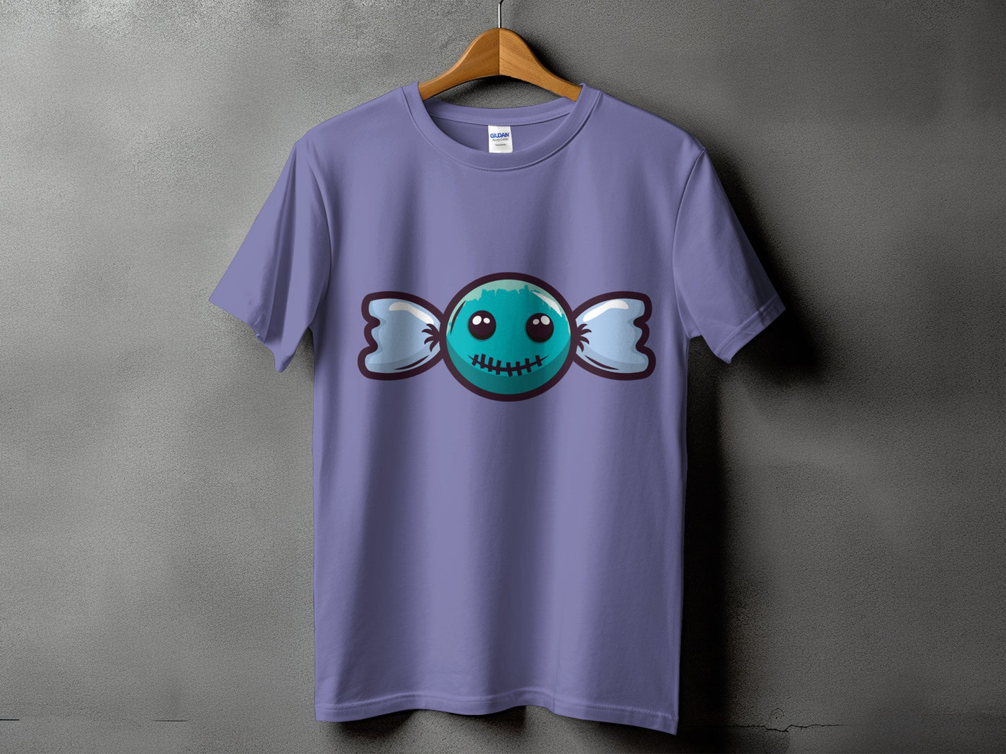 Purple t-shirt with a cartoon teal candy graphic with stitched mouth.