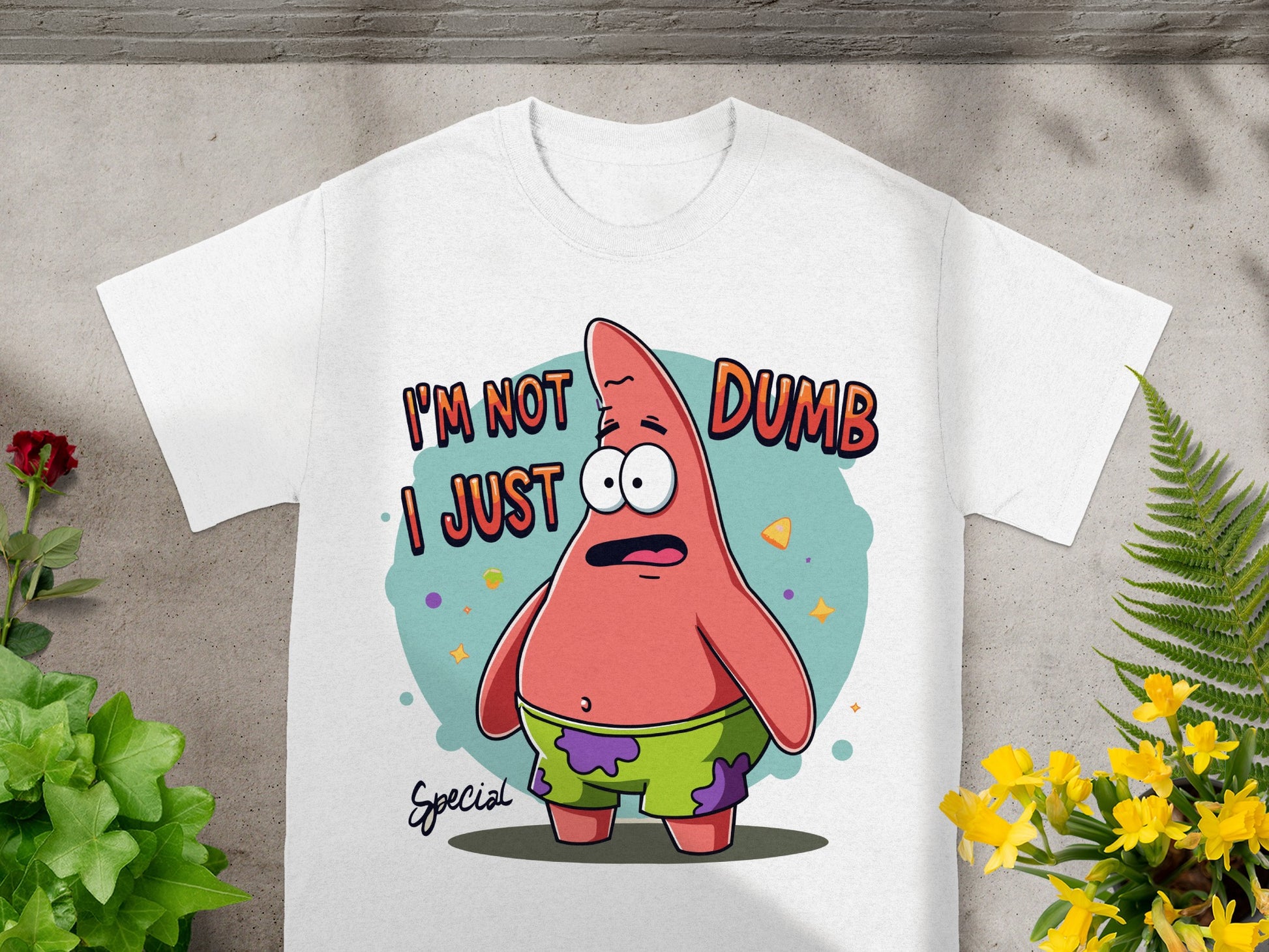 White t-shirt with Patrick Star graphic saying "I'm not dumb I just special".