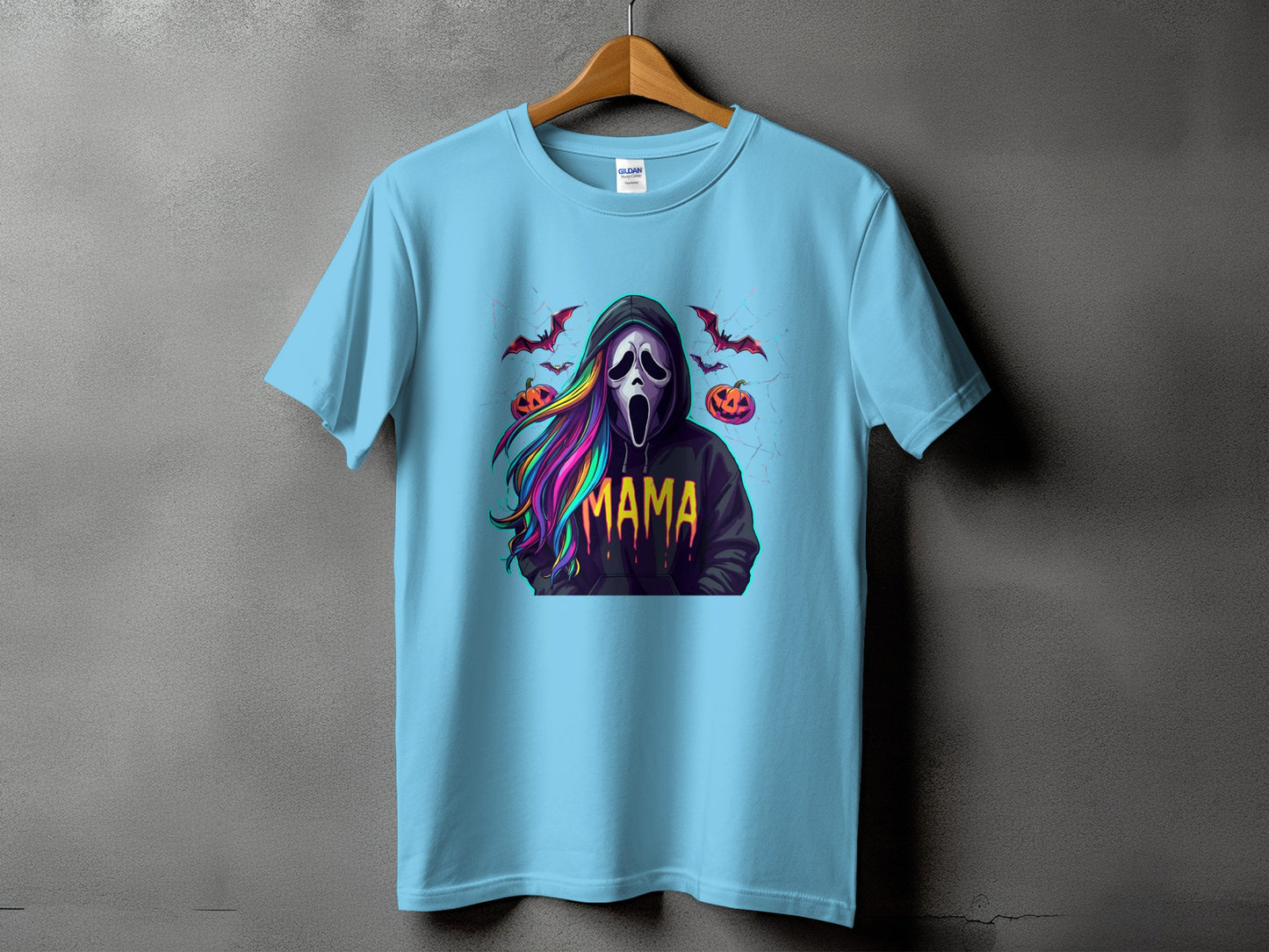 Light blue t-shirt with a screaming ghost mask, colorful hair, pumpkins, and bats.