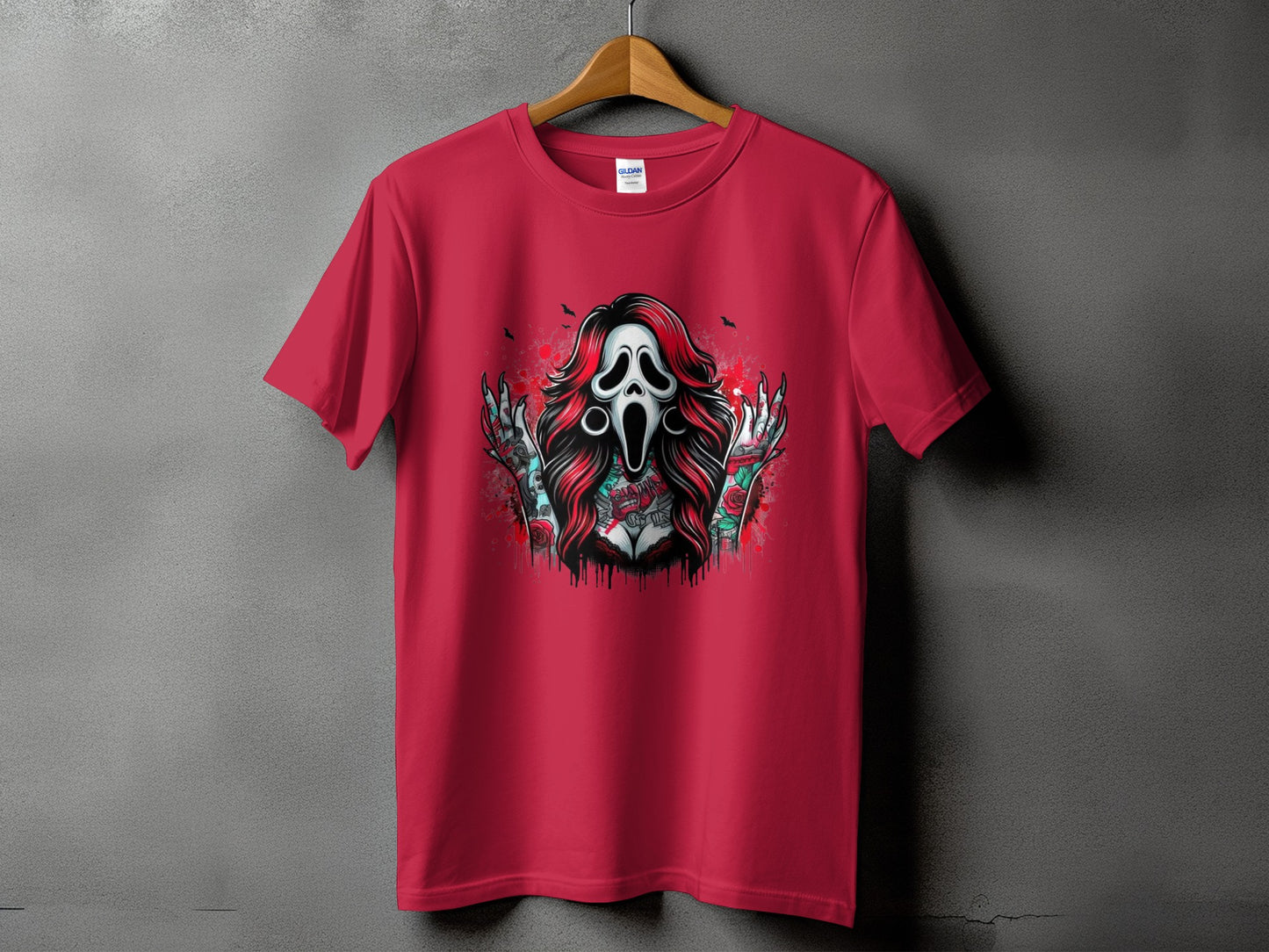 Red t-shirt with a graphic of a screaming ghost face, red hair, and tattooed arms.