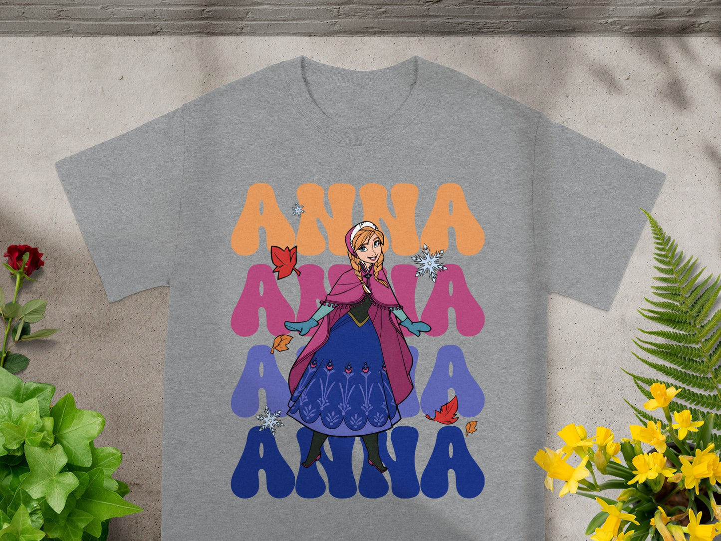 Grey t-shirt with Anna from Frozen graphic and colorful text.