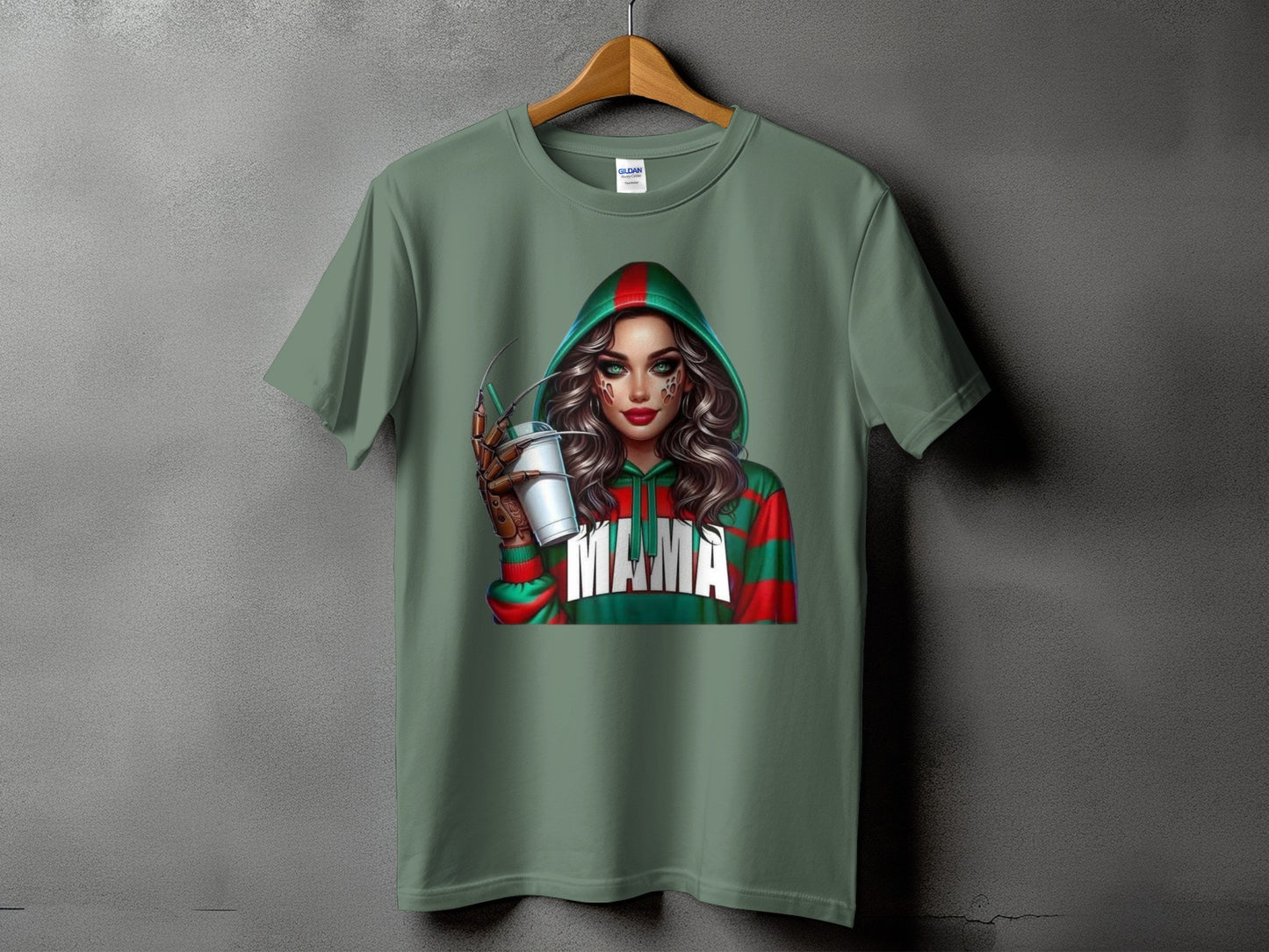 Green t-shirt with a graphic of a woman in a hooded sweater with red and green stripes and the word "MAMA".