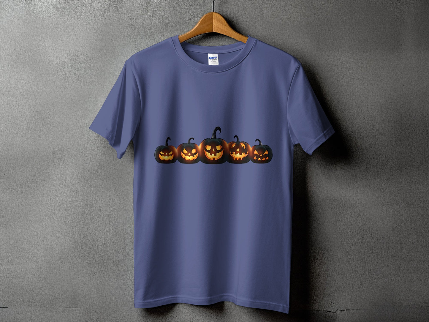 Purple t-shirt with a row of five jack-o'-lanterns graphic.