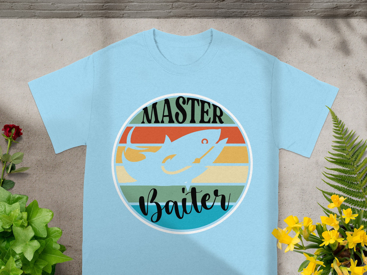 Light blue t-shirt with "MASTER Baiter" text and a shark fishing graphic.