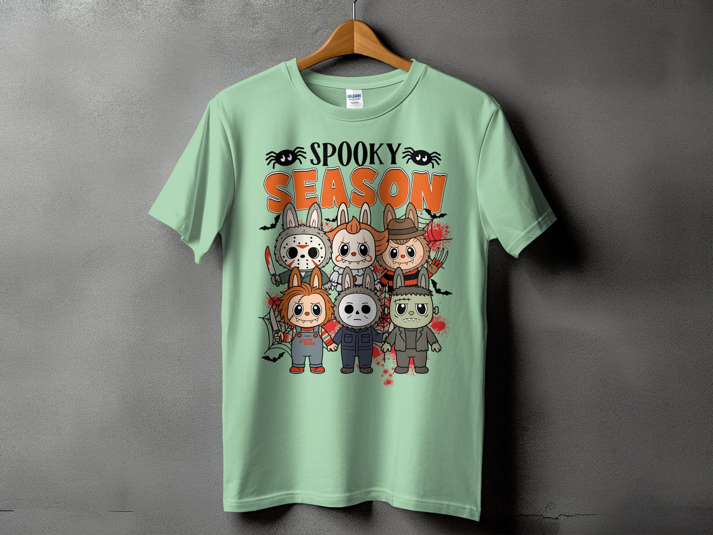 Light green t-shirt with "Spooky Season" text and chibi horror characters.