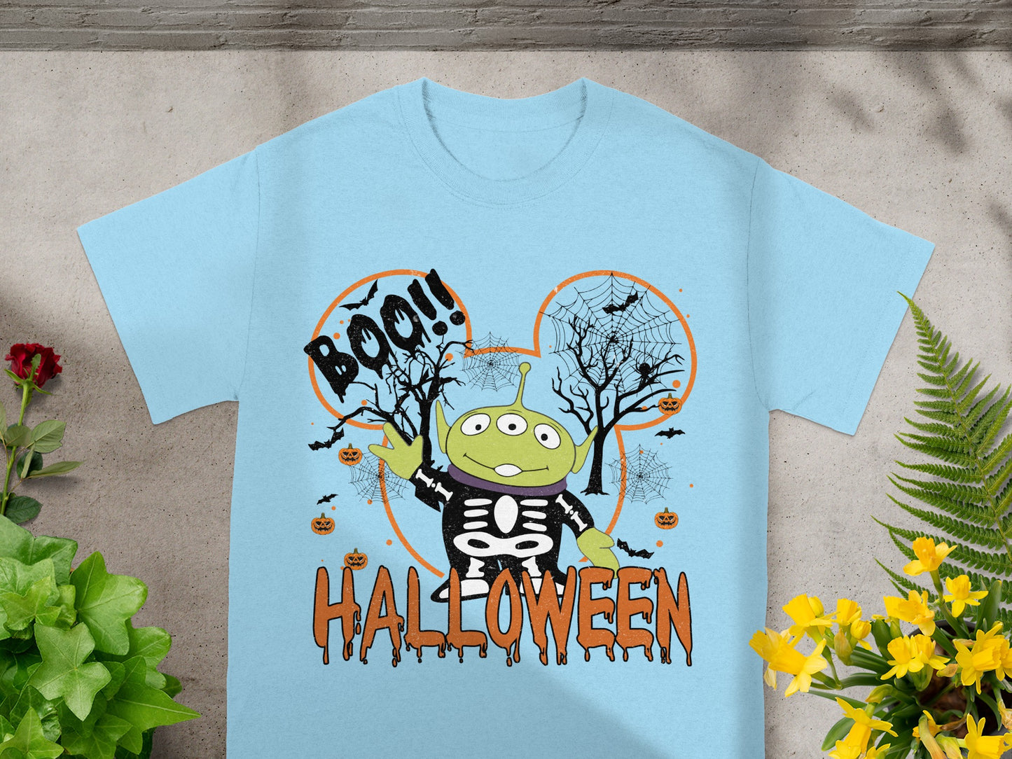 Light blue t-shirt with alien skeleton graphic and "Boo!!" and "Halloween" text.
