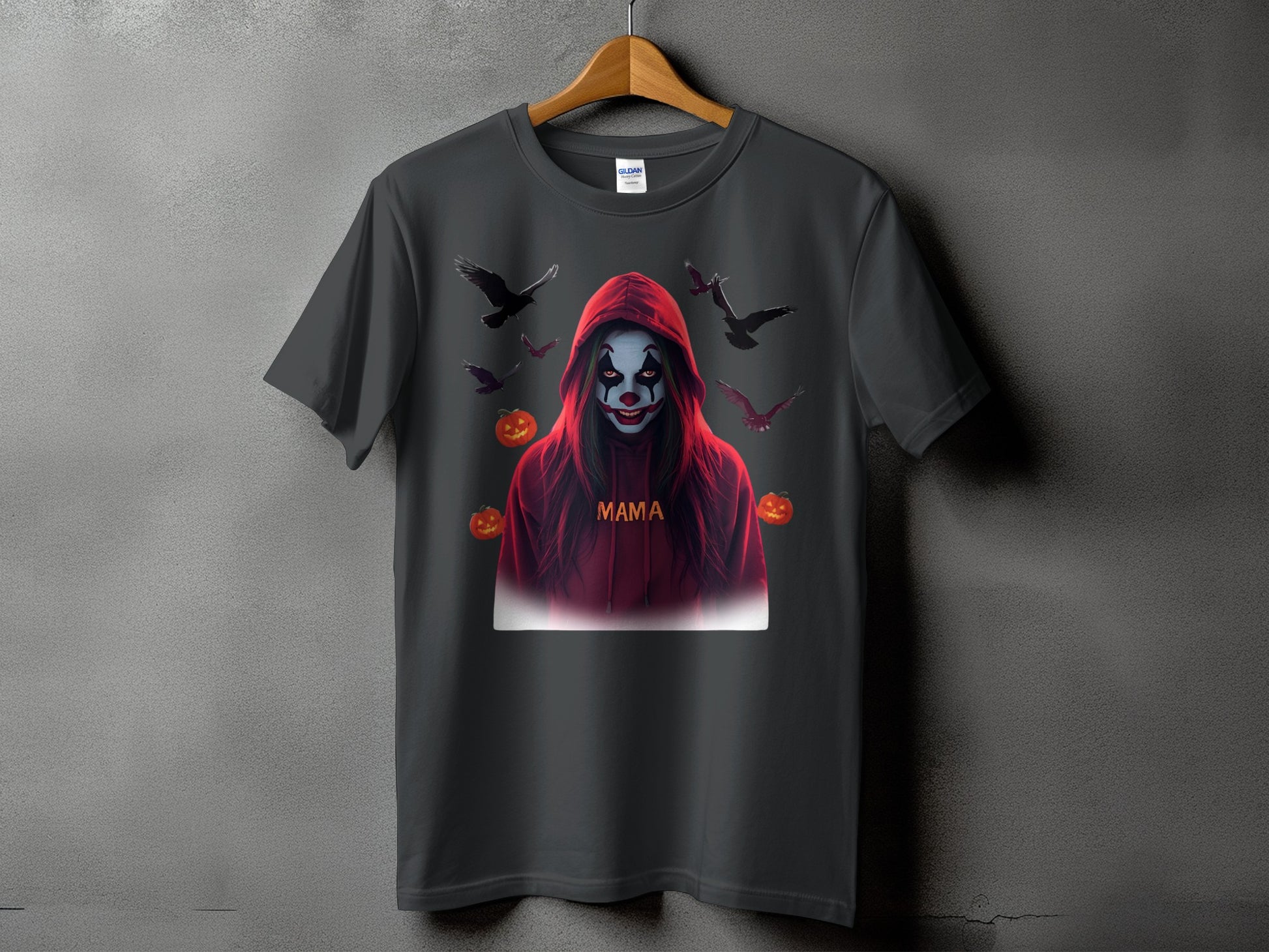 Dark t-shirt with a hooded clown graphic, crows, and pumpkins.