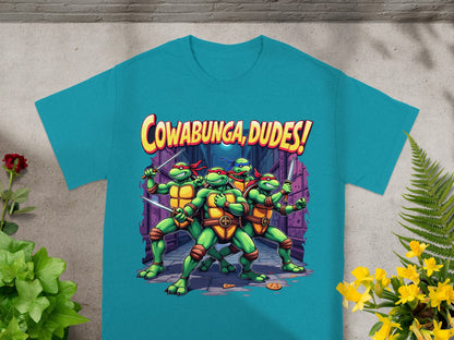 Teenage Mutant Ninja Turtles on t-shirt with "Cowabunga, Dudes!" text.