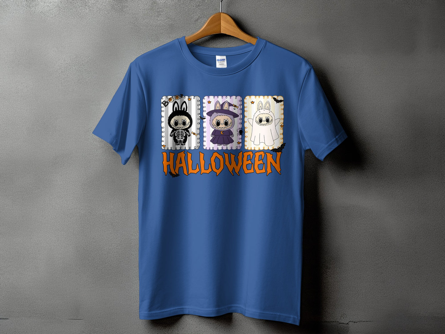 Blue t-shirt with three Halloween themed cartoon characters and the word "HALLOWEEN".