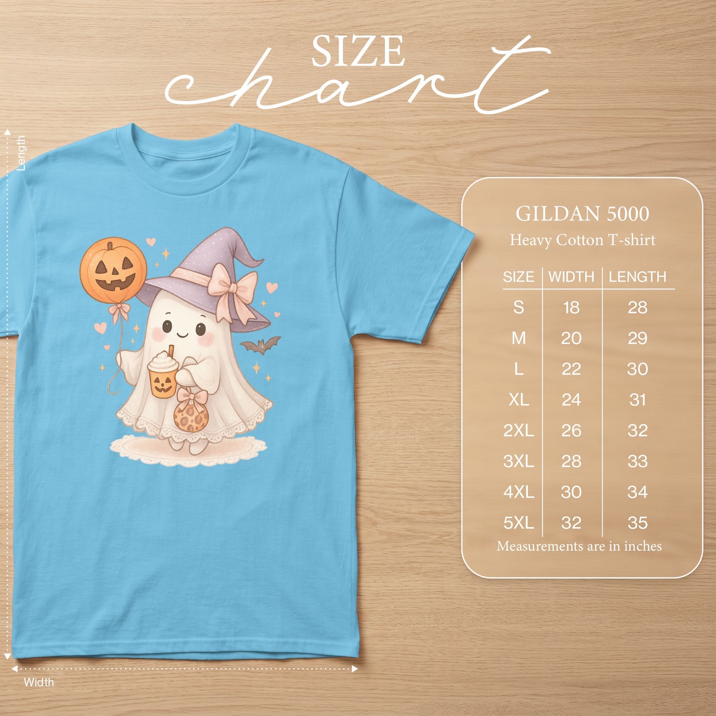 Blue t-shirt with a kawaii ghost wearing a witch hat and holding Halloween treats. Includes size chart.