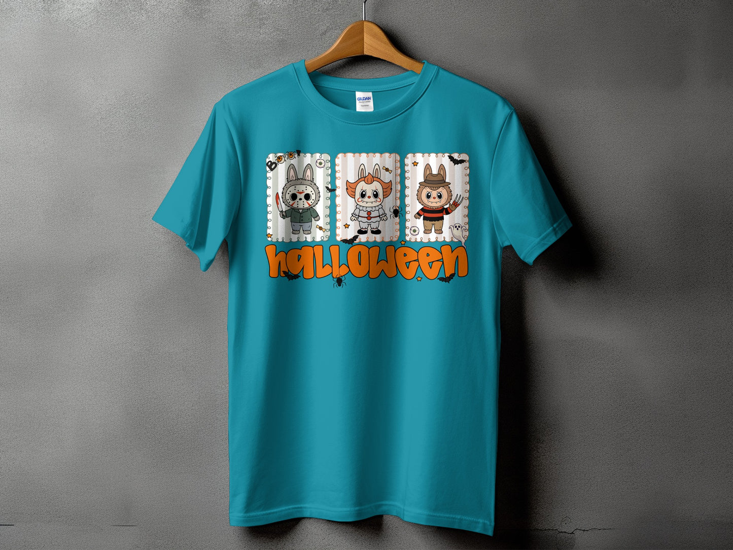 Teal t-shirt with three cartoon Halloween characters and "Halloween" text.