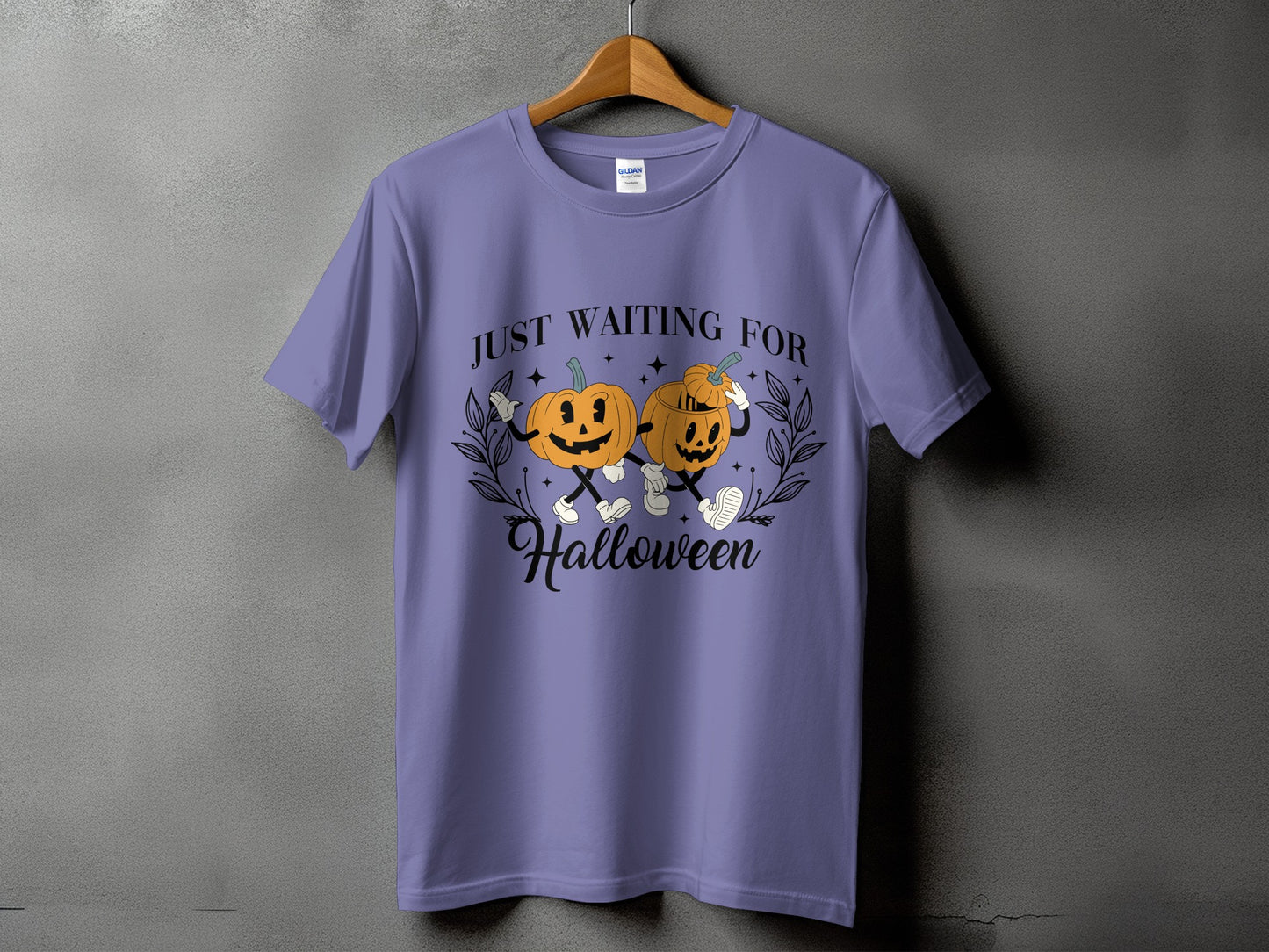 Purple t-shirt with cartoon pumpkins and "Just Waiting For Halloween" text.