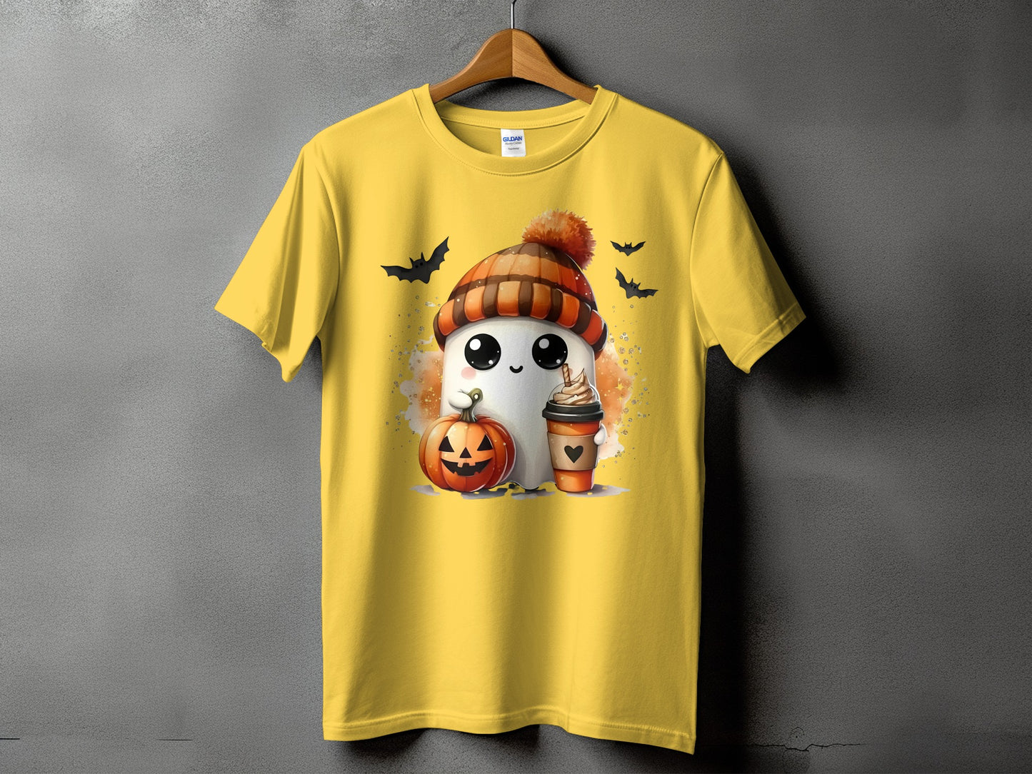 Yellow t-shirt with a cute ghost, jack-o'-lantern, and coffee cup Halloween graphic.