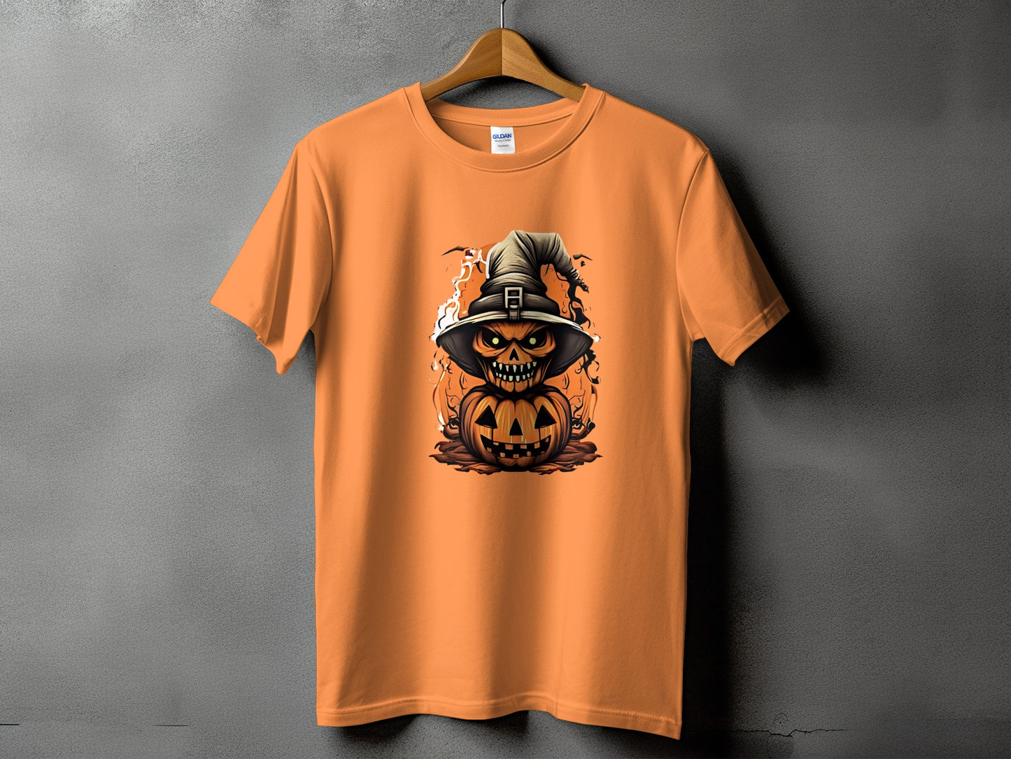 Orange t-shirt with a jack-o'-lantern character wearing a witch hat.