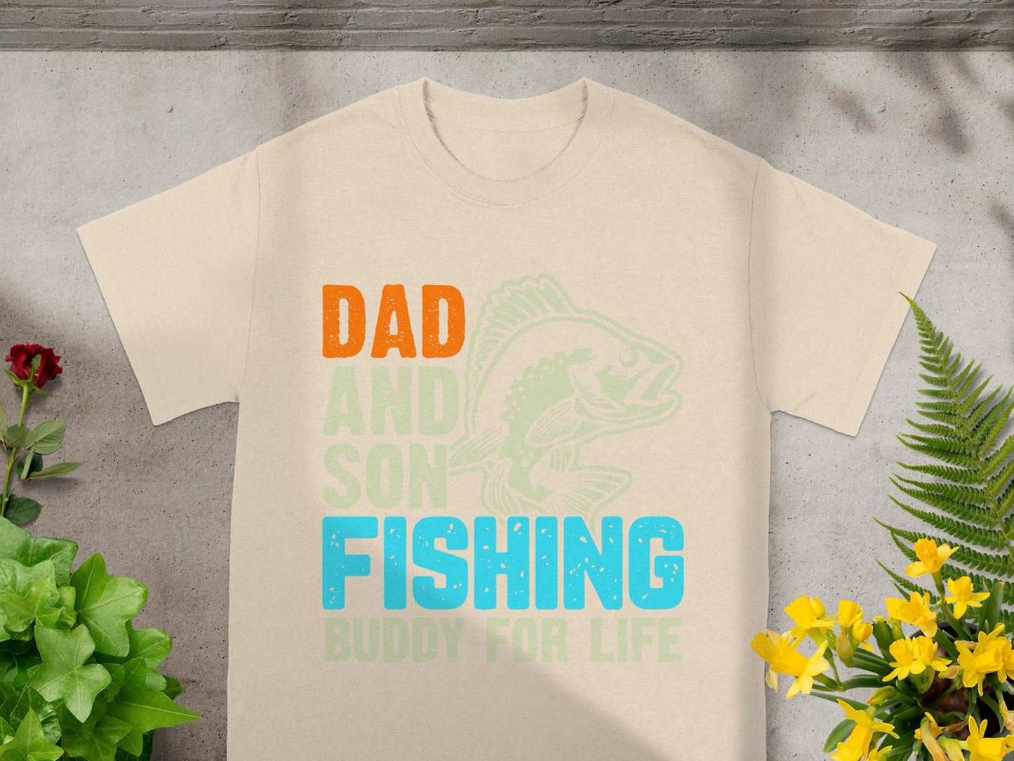 Dad and Son Fishing Buddy For Life graphic on a tan t-shirt.