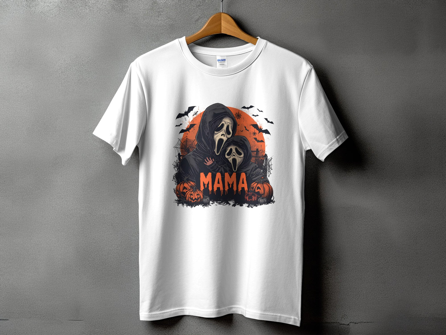 White t-shirt with Halloween graphic featuring ghosts and pumpkins, and the word "MAMA".