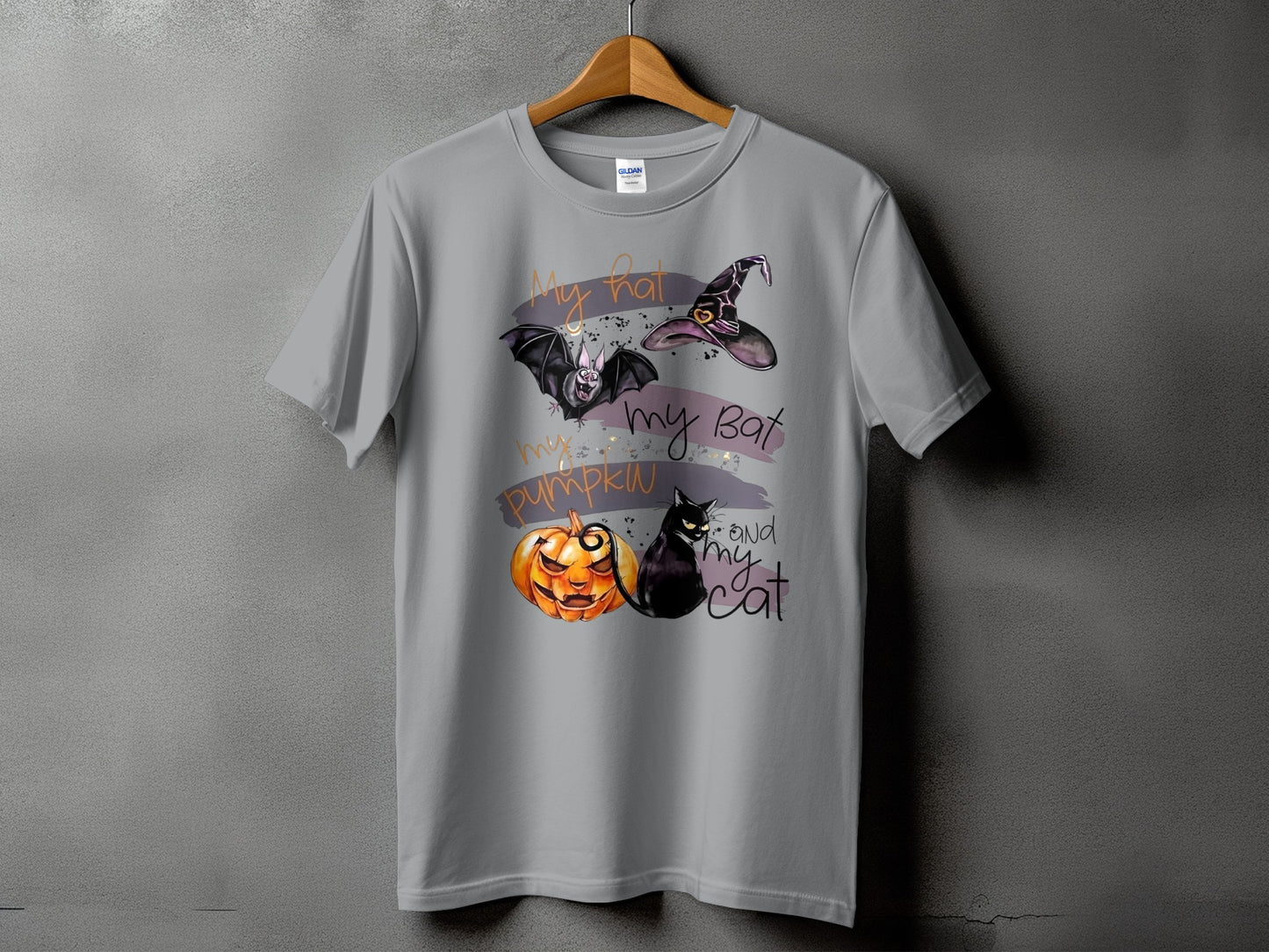 Gray t-shirt with Halloween graphic: witch hat, bat, pumpkin, and black cat.