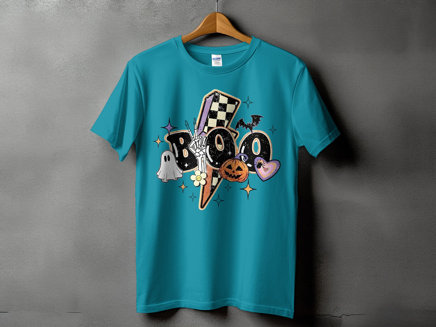 Teal t-shirt with "BOO" graphic featuring ghost, skeleton hand, pumpkin, and heart.